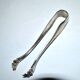 Vintage silver metal sugar or ice cube tongs with engraved lion claw decoration