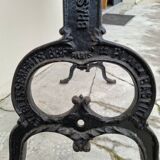 Solid oak bistro table with a cast iron base, signed.