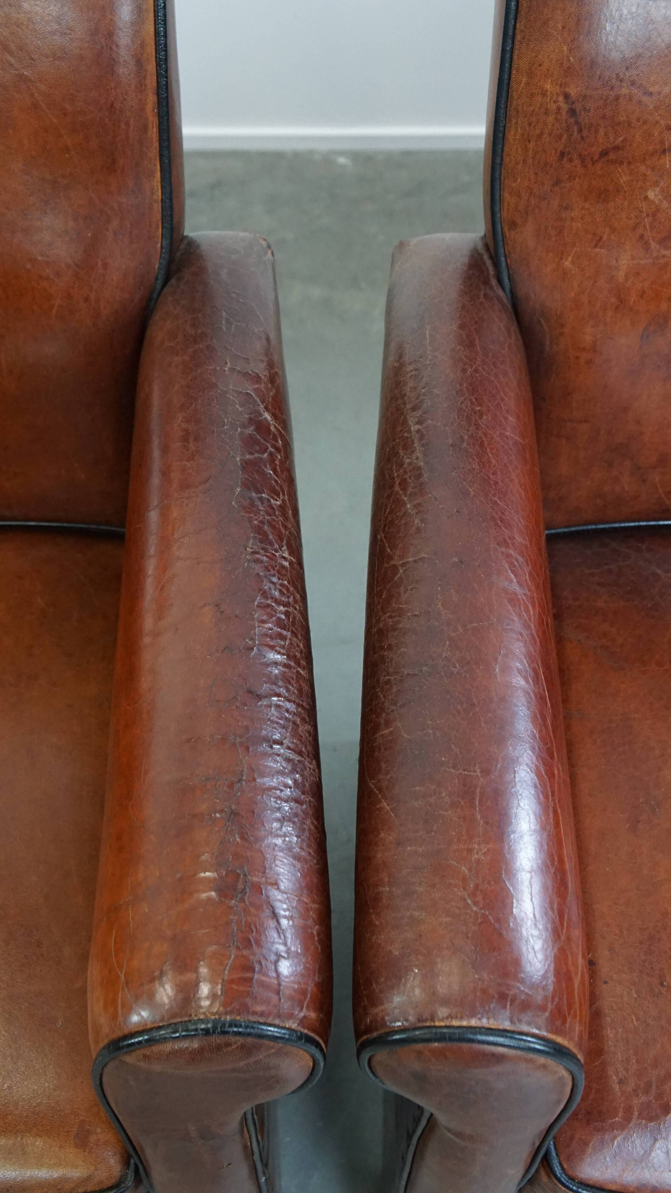 Vintage set of 4 sheepskin leather dining chairs on castors