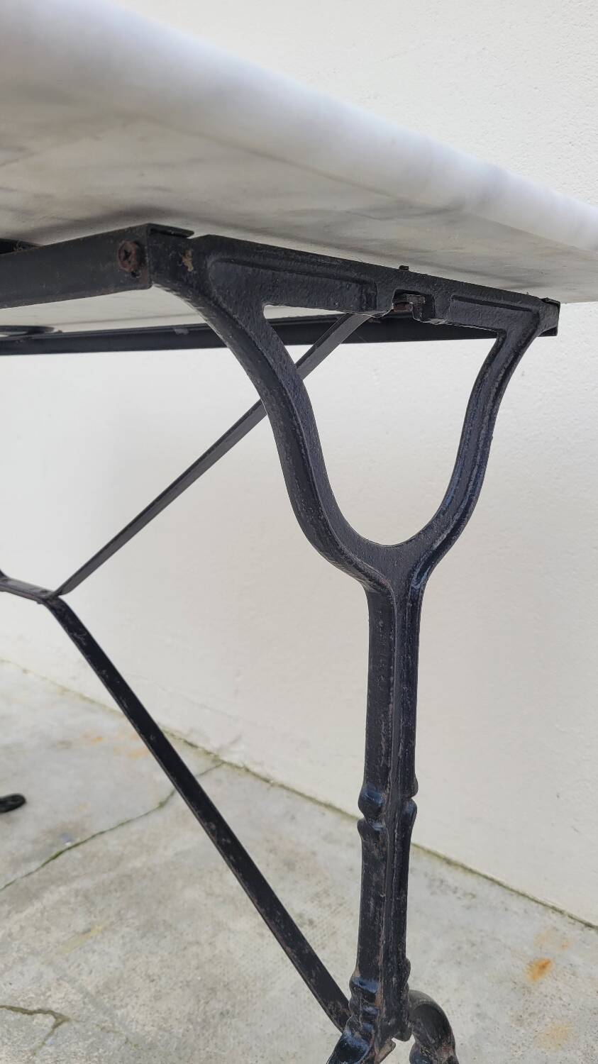 Marble and antique cast iron bistro table