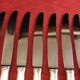 Service de 12 couteaux de table orfèvre Deetjen en écrin