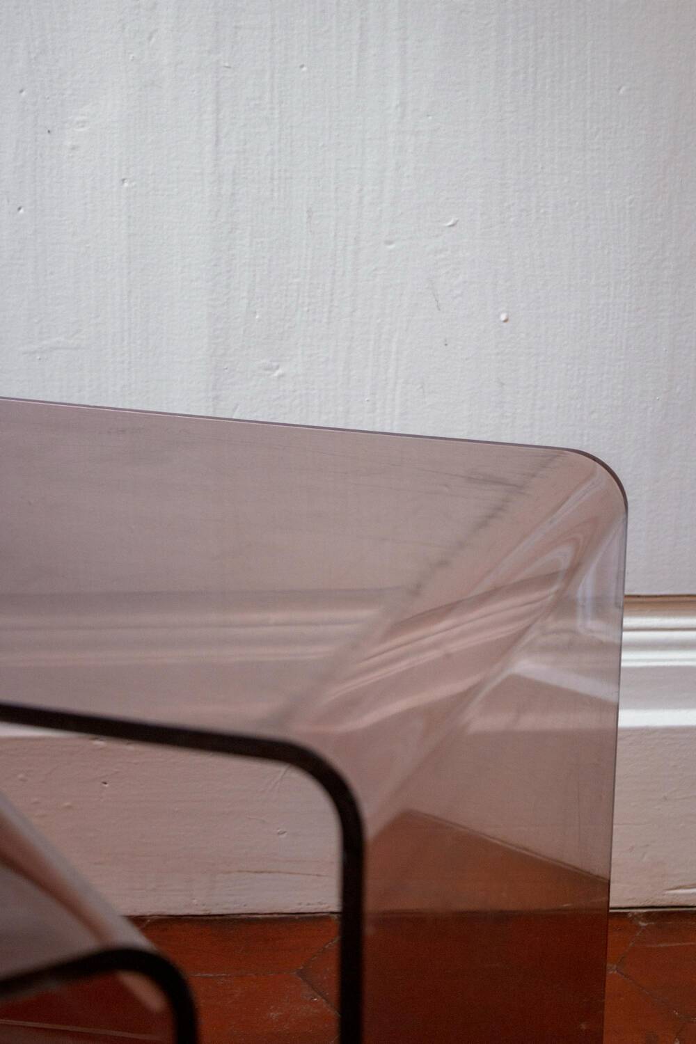 Vintage trio of nesting tables in smoked plexiglass by Michel Dumas, year.