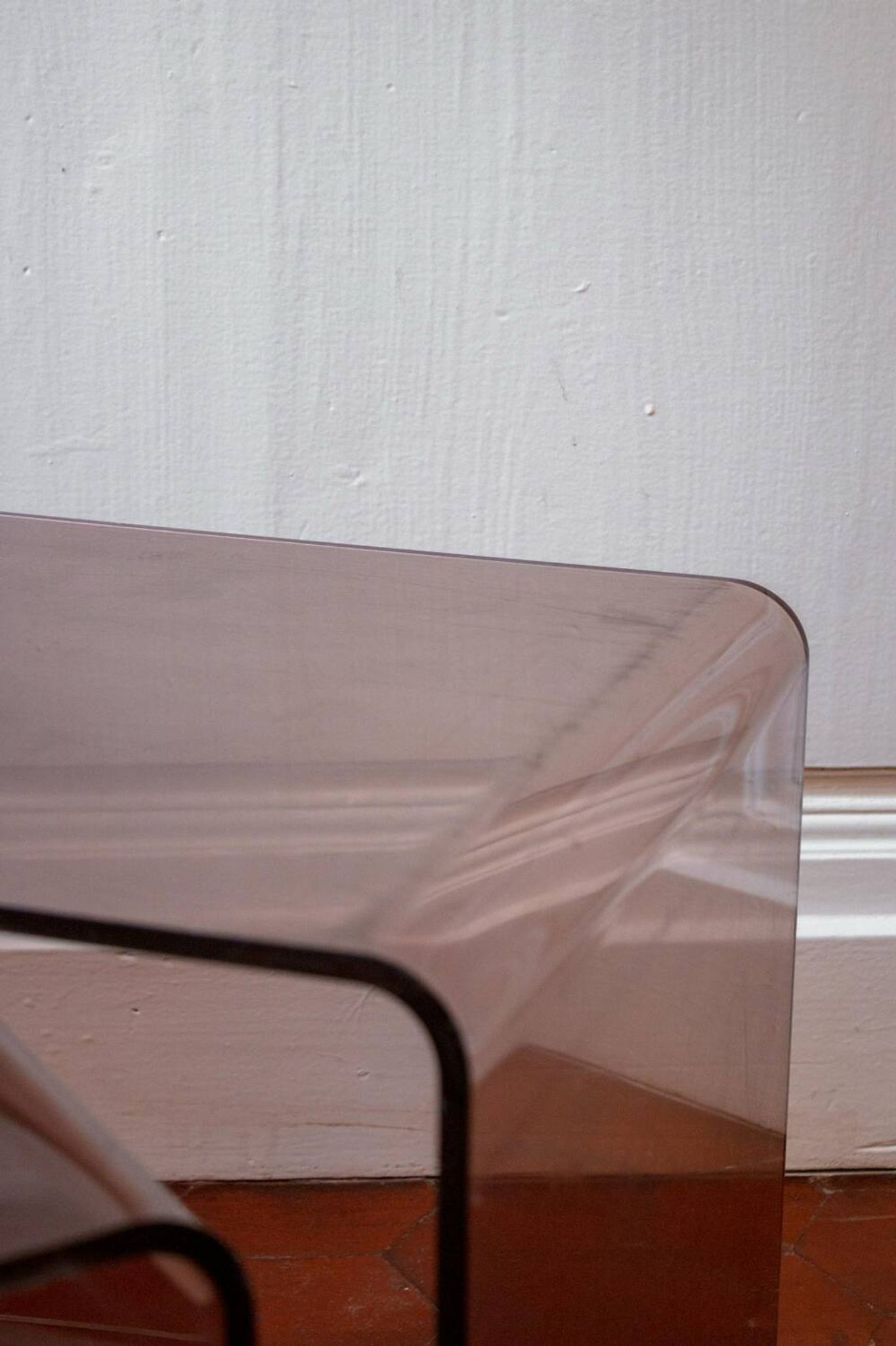 Vintage trio of nesting tables in smoked plexiglass by Michel Dumas, year.