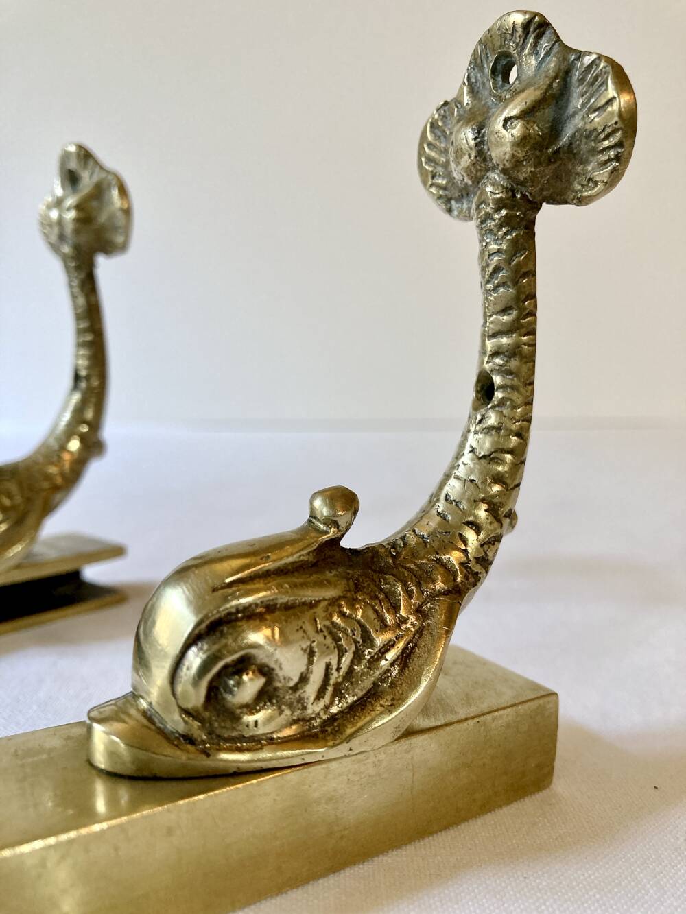 Brass wall supports for bathroom shelf, circa 1950.