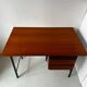 Vintage wooden and metal desk in modernist style.