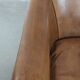 Characterful club chair made of sheepskin leather with light cognac colours