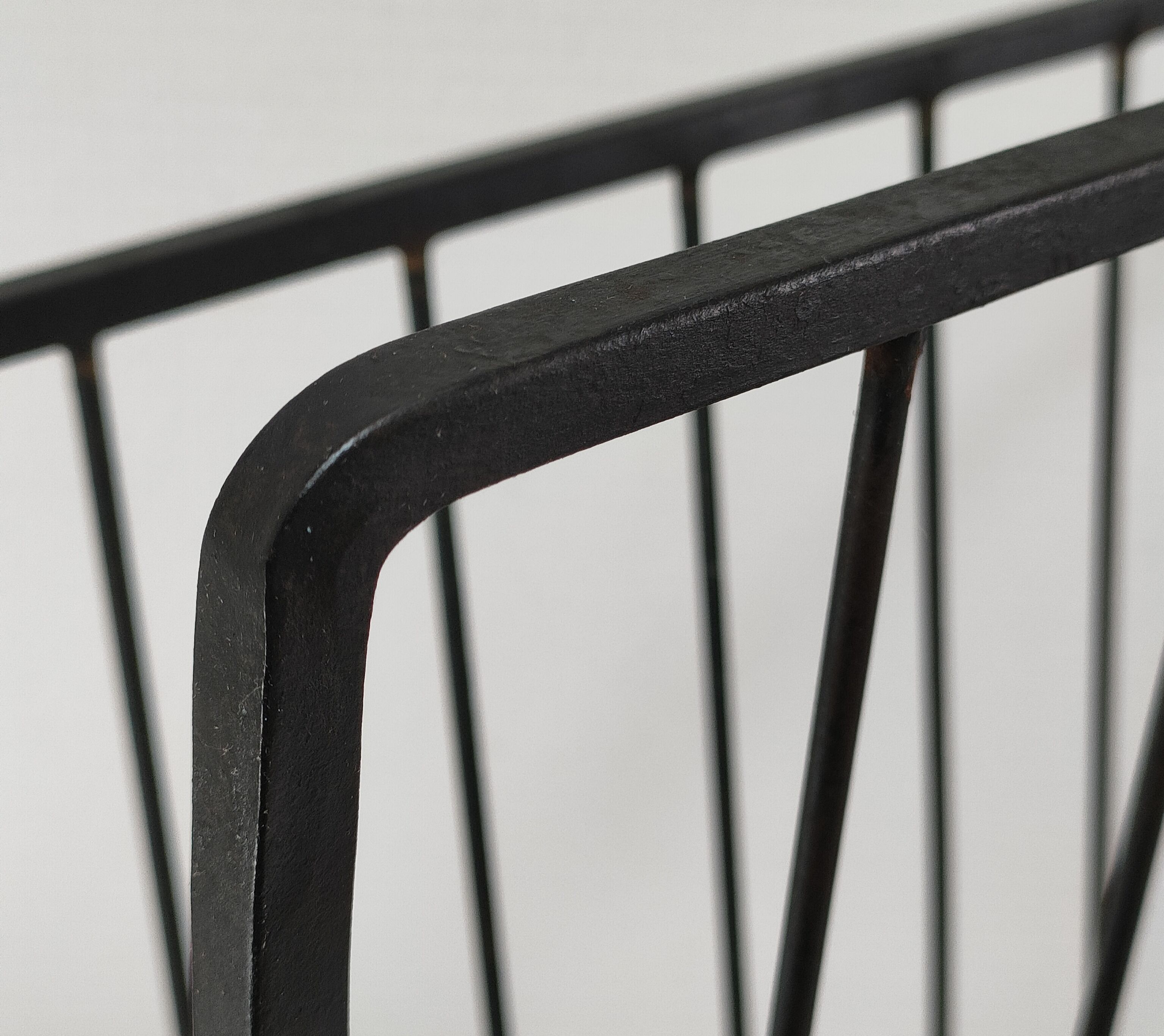 Modernist magazine holder black iron 60s