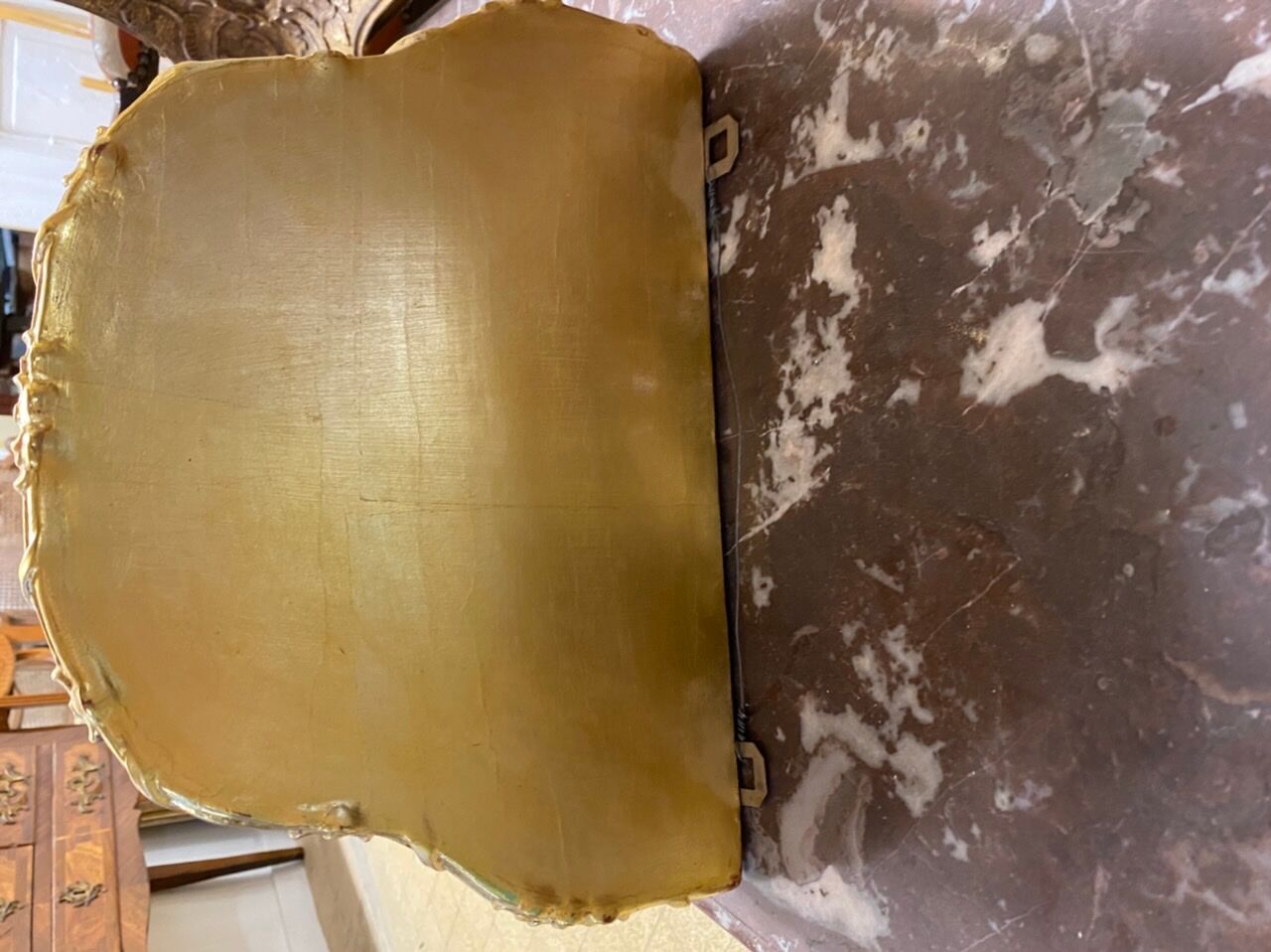 Golden wall applique with gold leaf