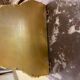 Golden wall applique with gold leaf