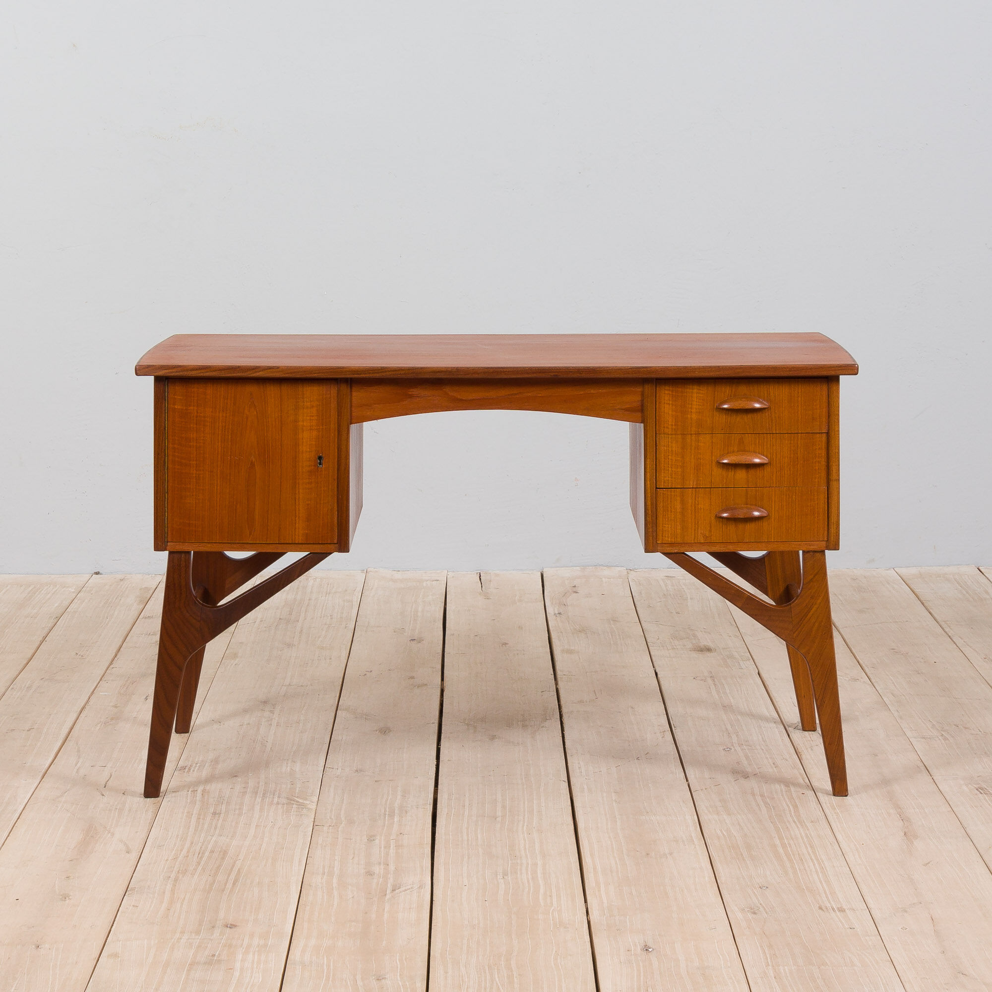 Danish mid century teak desk on sculptural base, 1960s.