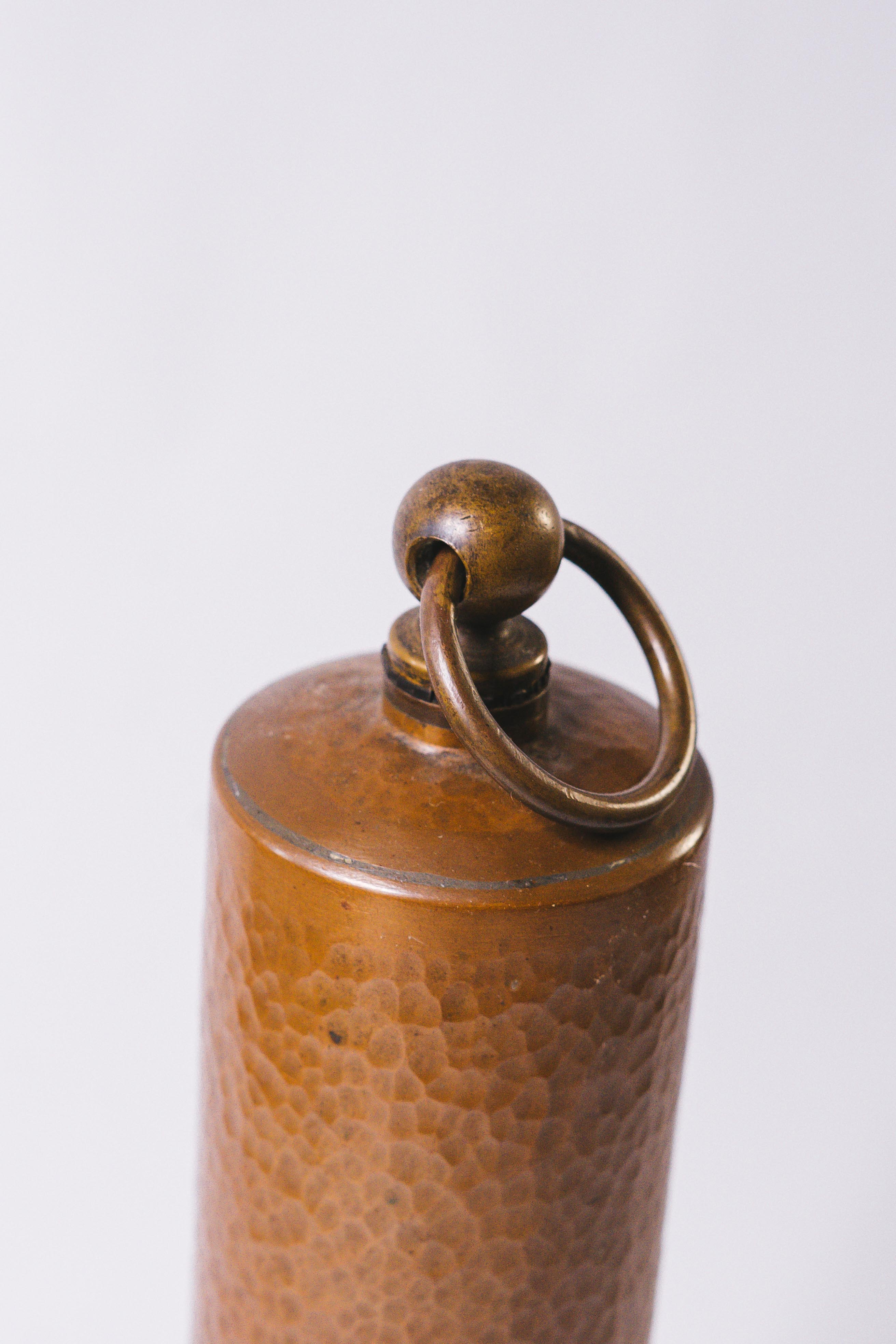 Old copper hot water bottle