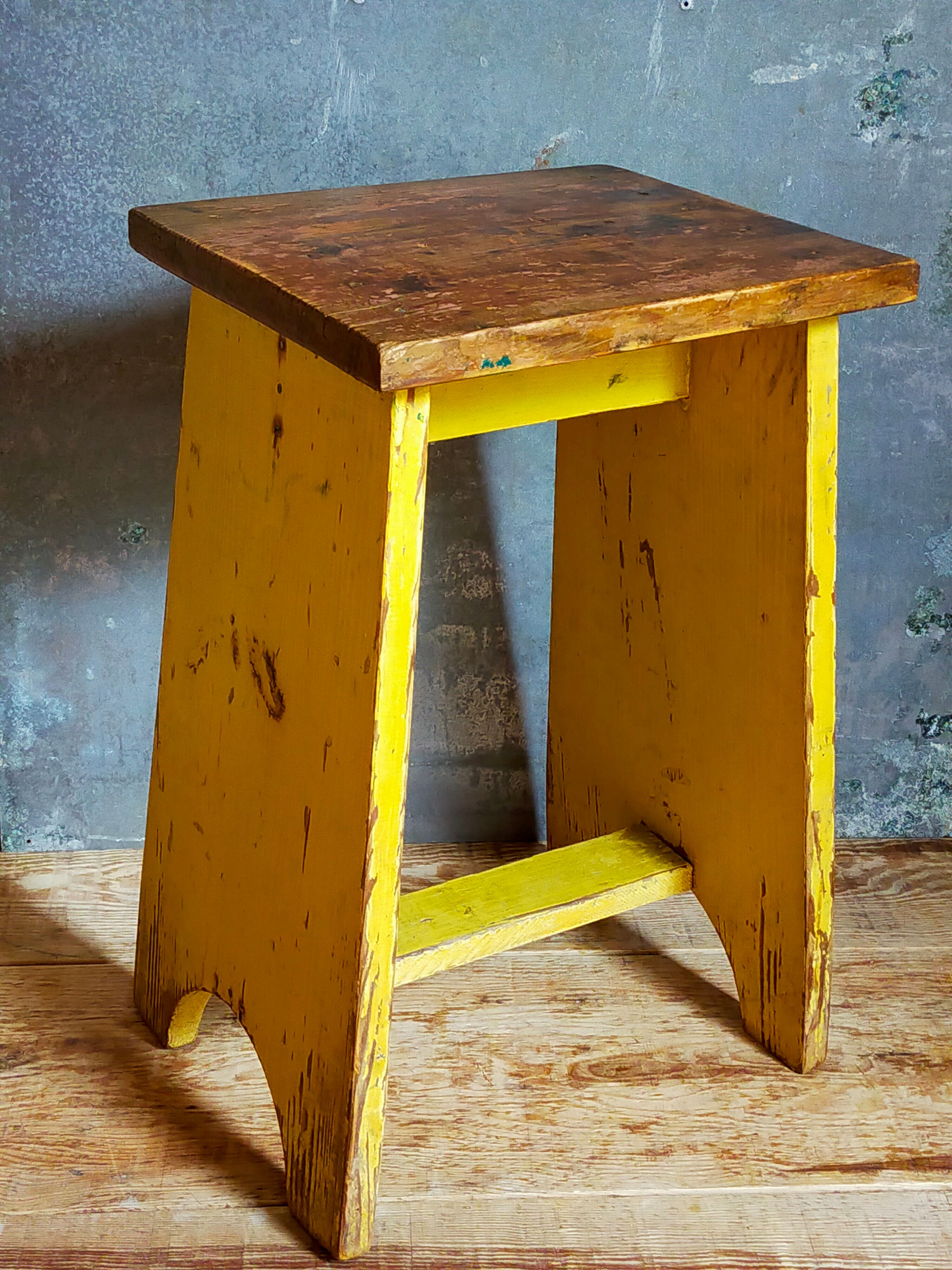 Art-populaire workshop stool in patinated wood