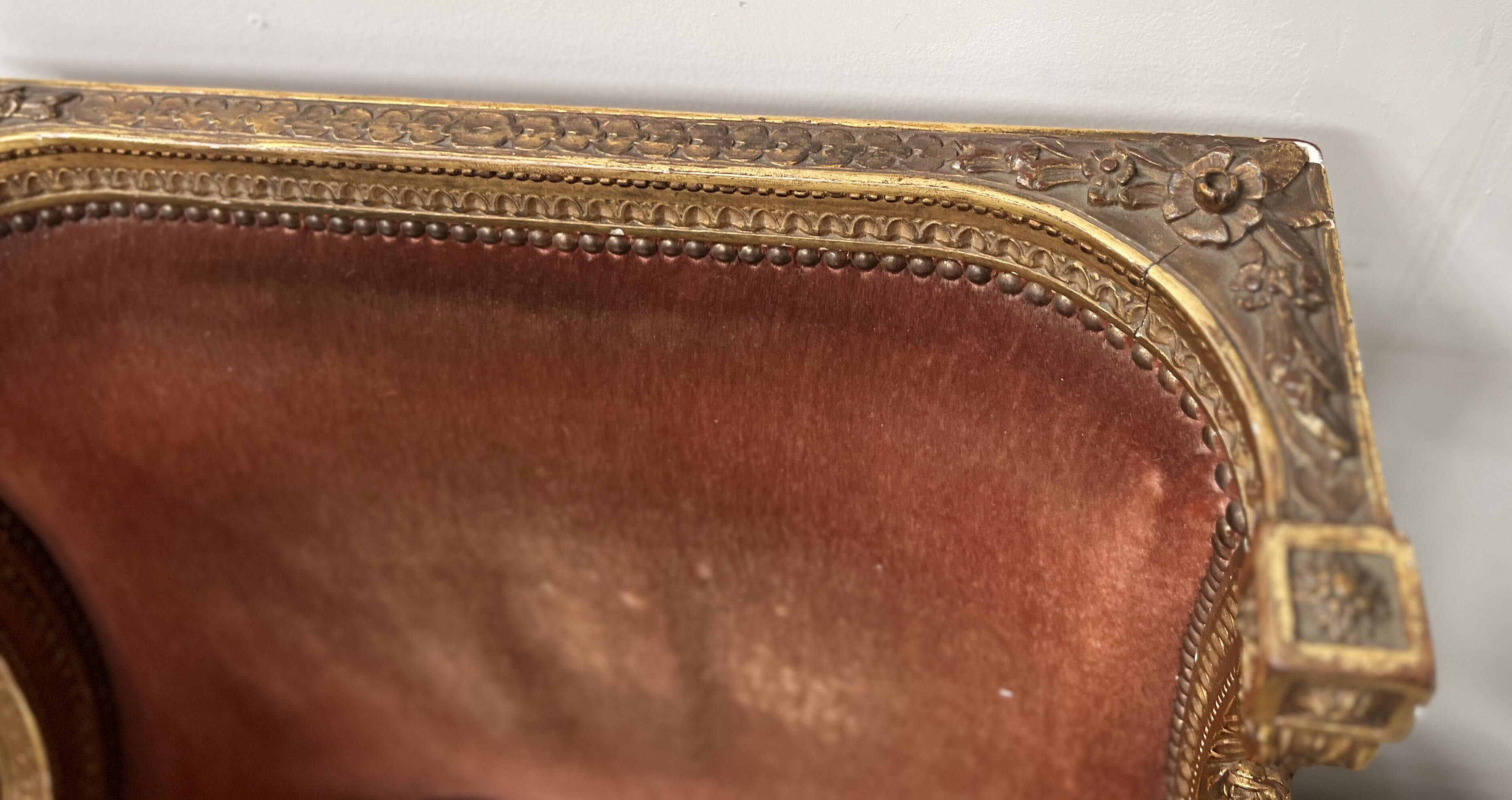 Two Louis XVI style wing chairs in gilded wood, 20th century