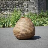 Old basket, burgundy straw and bramble, woven basket, interior decoration