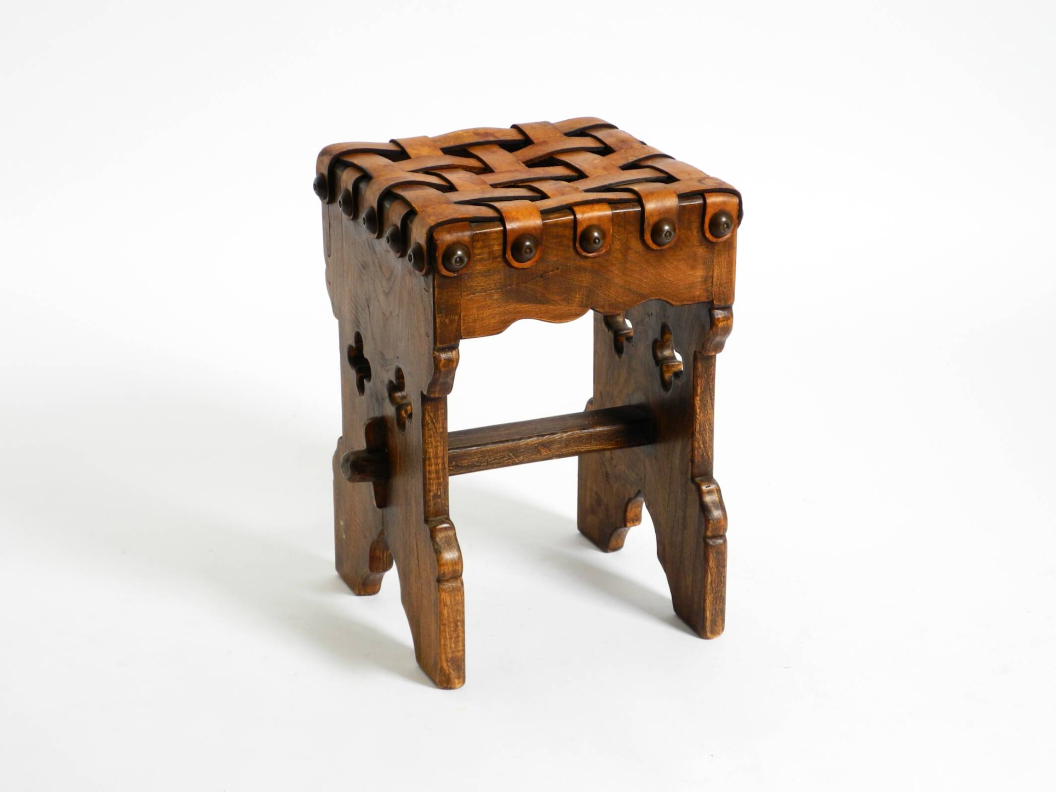 Beautiful 1940s oak stool with a seat made of leather straps