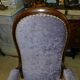 Relaxed Voltaire armchair with walnut racks