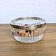Cut glass bowl with silver-plated edge