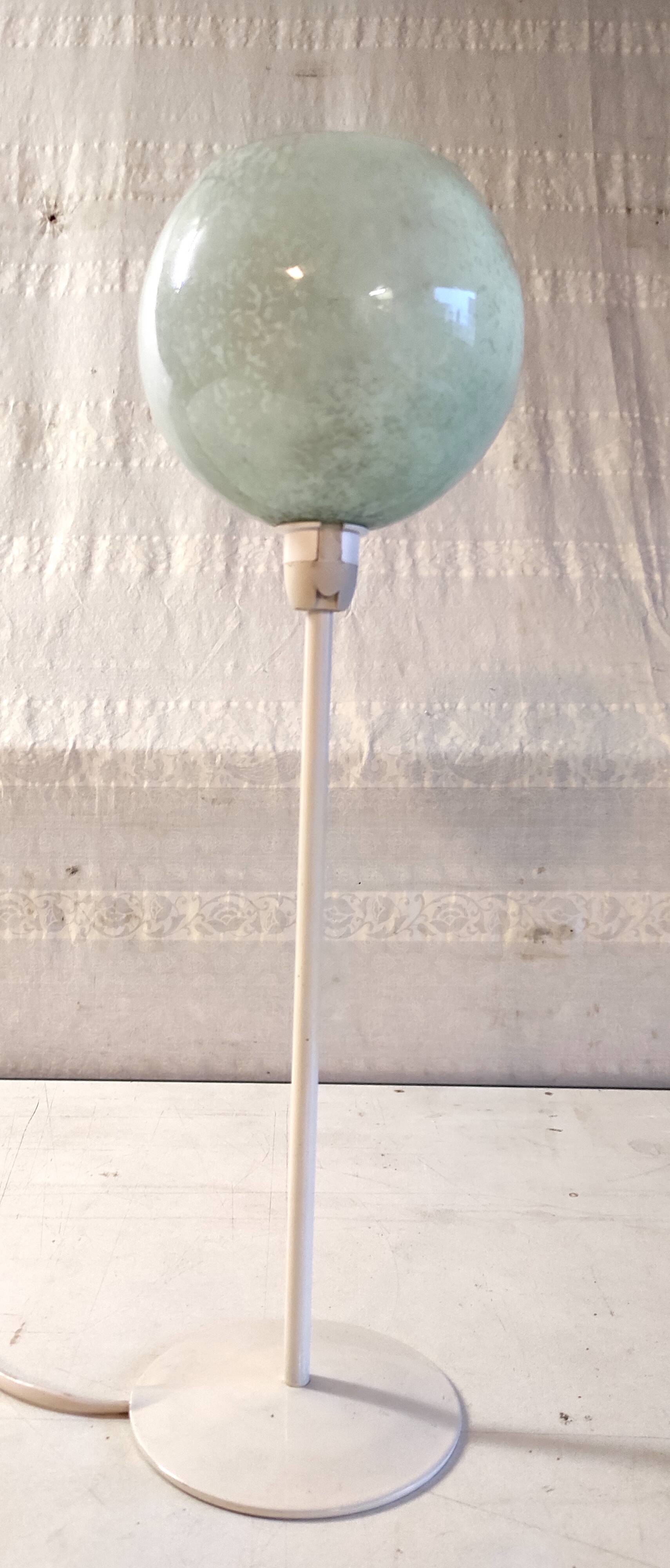 Table lamp with a pale green Clichy glass globe.