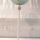 Table lamp with a pale green Clichy glass globe.