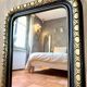 Louis-Philippe black and gold antique mirror from the 19th century