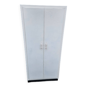 Old industrial metal cabinet in white and blue.