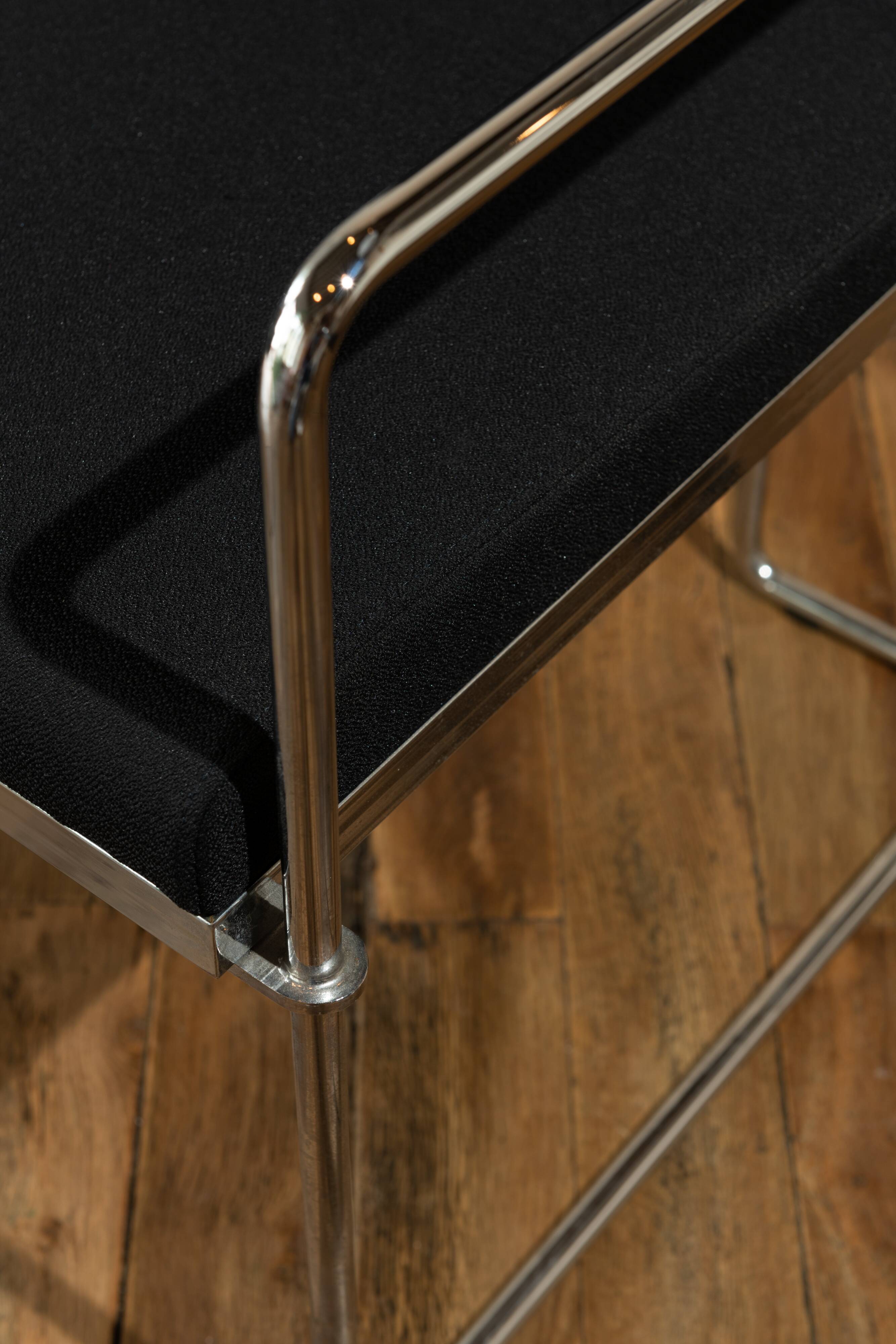 Four armchairs in tubular metal and black fabric 1990