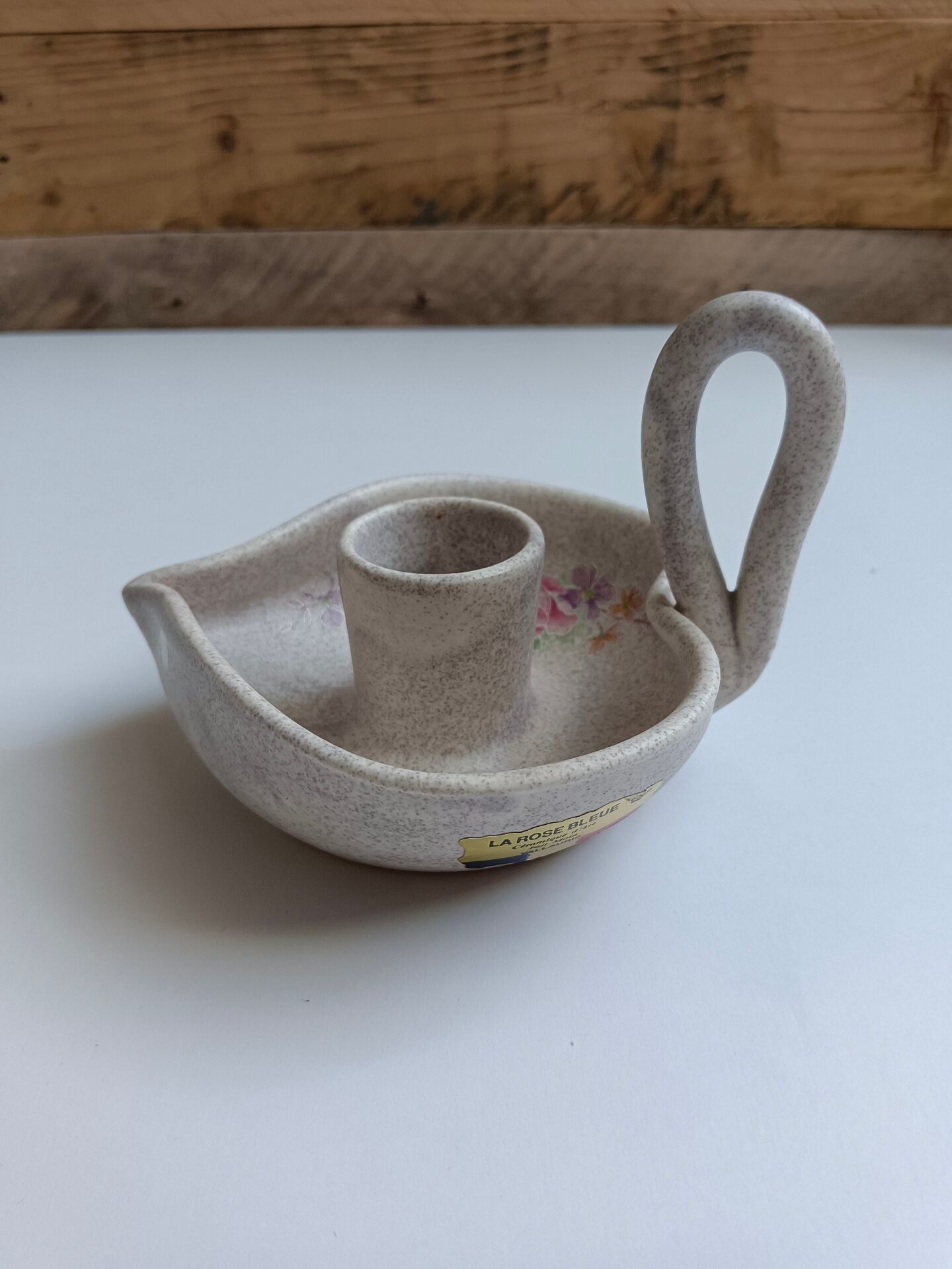 Vallauris grey candle holder with pink flowers, signed.
