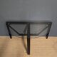 Black metal console with glass top