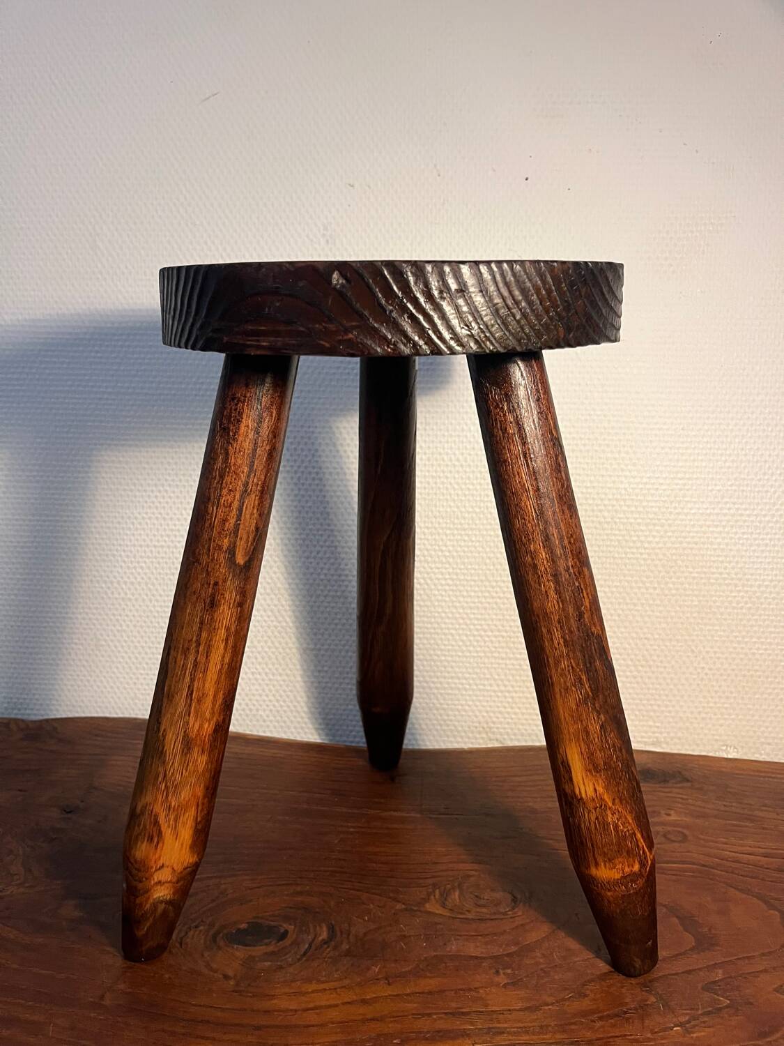 Round wooden tripod stool