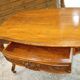 Curved desk in Louis XV style, made of carved and moulded walnut.