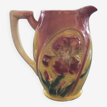 Old pitcher with pink iris decor