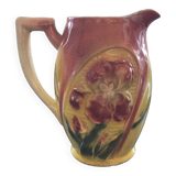 Old pitcher with pink iris decor
