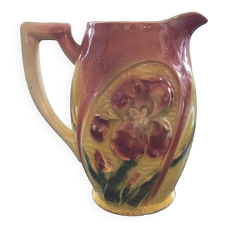 Old pitcher with pink iris decor