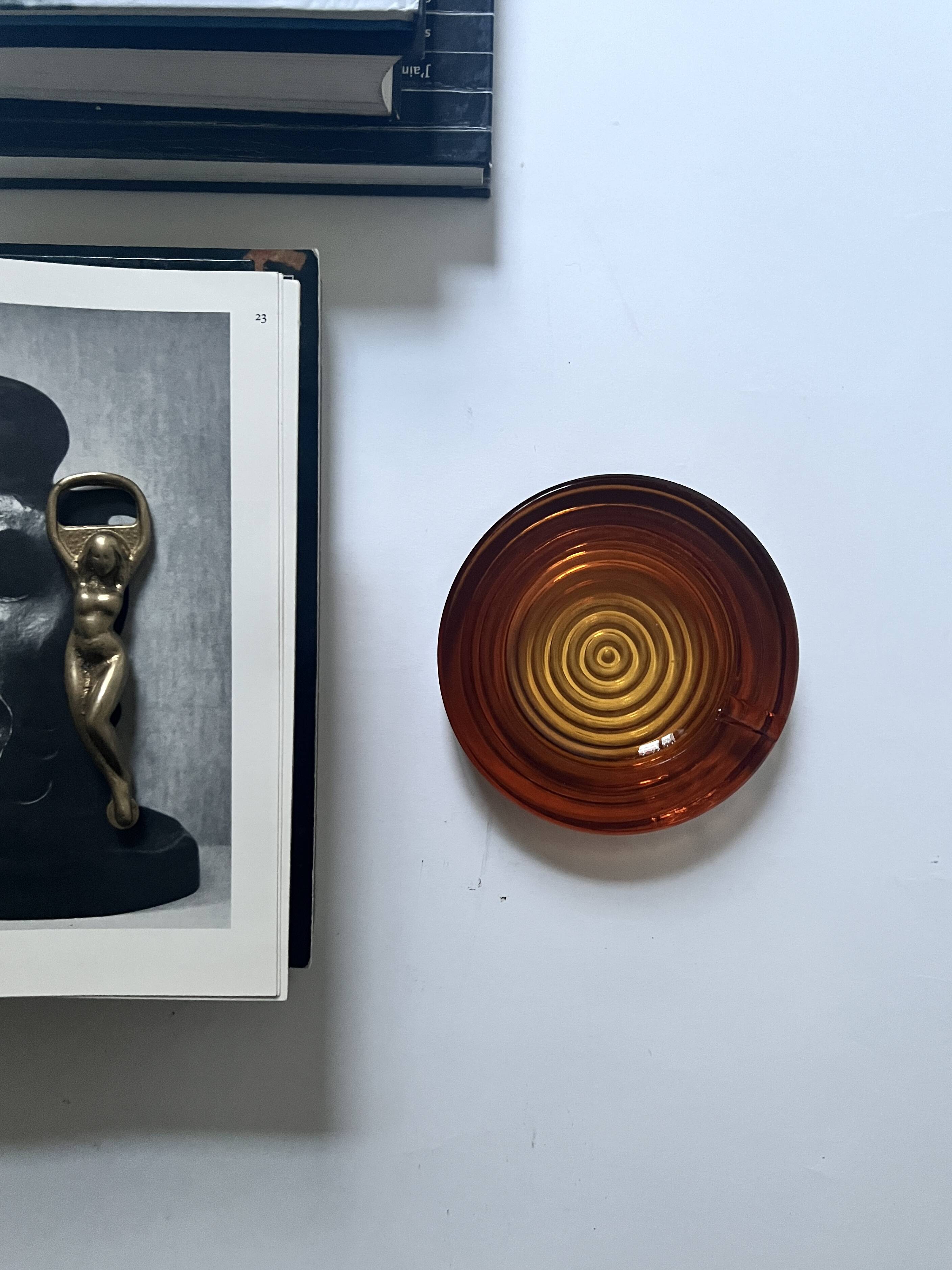 Amber pressed glass ashtray, 1970s design.