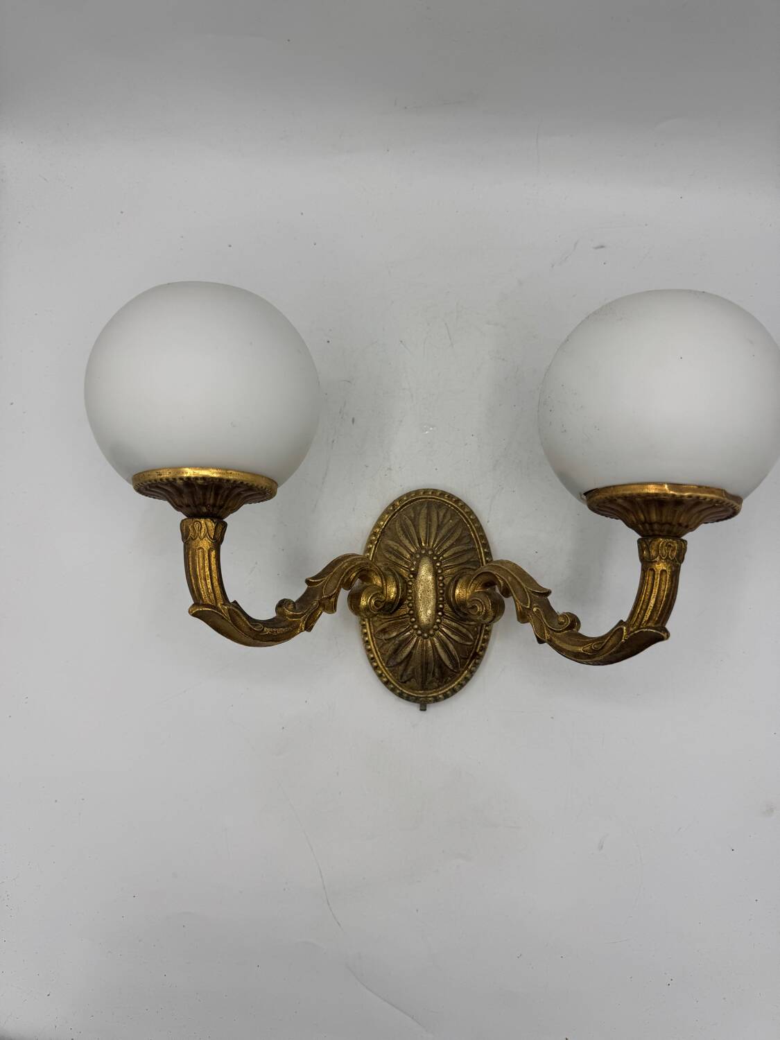 Double gold wall light