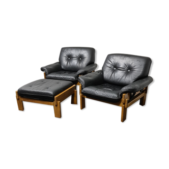 Pair of oak  framed  and black leather lounge chairs and ottoman