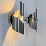 Pair of vintage wall lights, curved patinated steel, France, 1970.