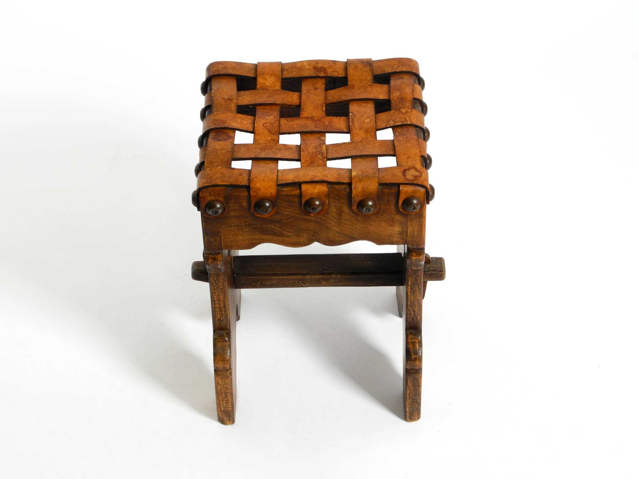 Beautiful 1940s oak stool with a seat made of leather straps