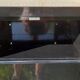 Black metal clamshell cabinet