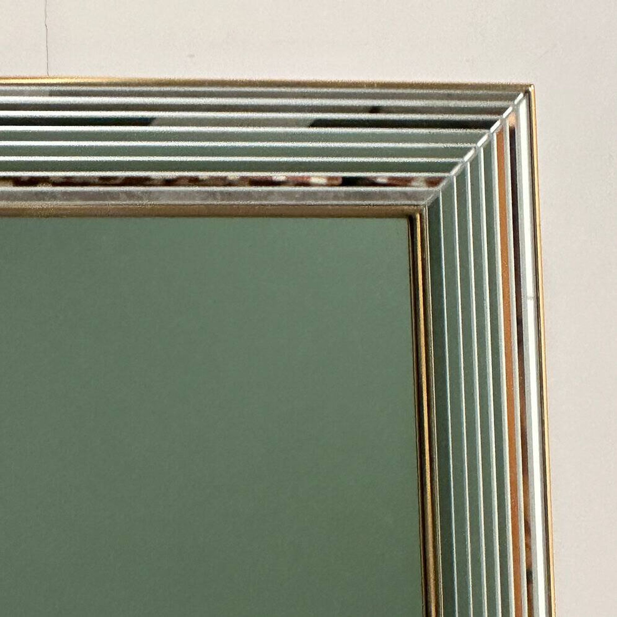 DeKnudt 1980s “Disco” mirror with layered bevelled frame & gilt trim