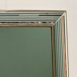 Miroir « Disco » DeKnudt des années 1980, avec cadre biseauté à plusieurs niveaux et bordure dorée.