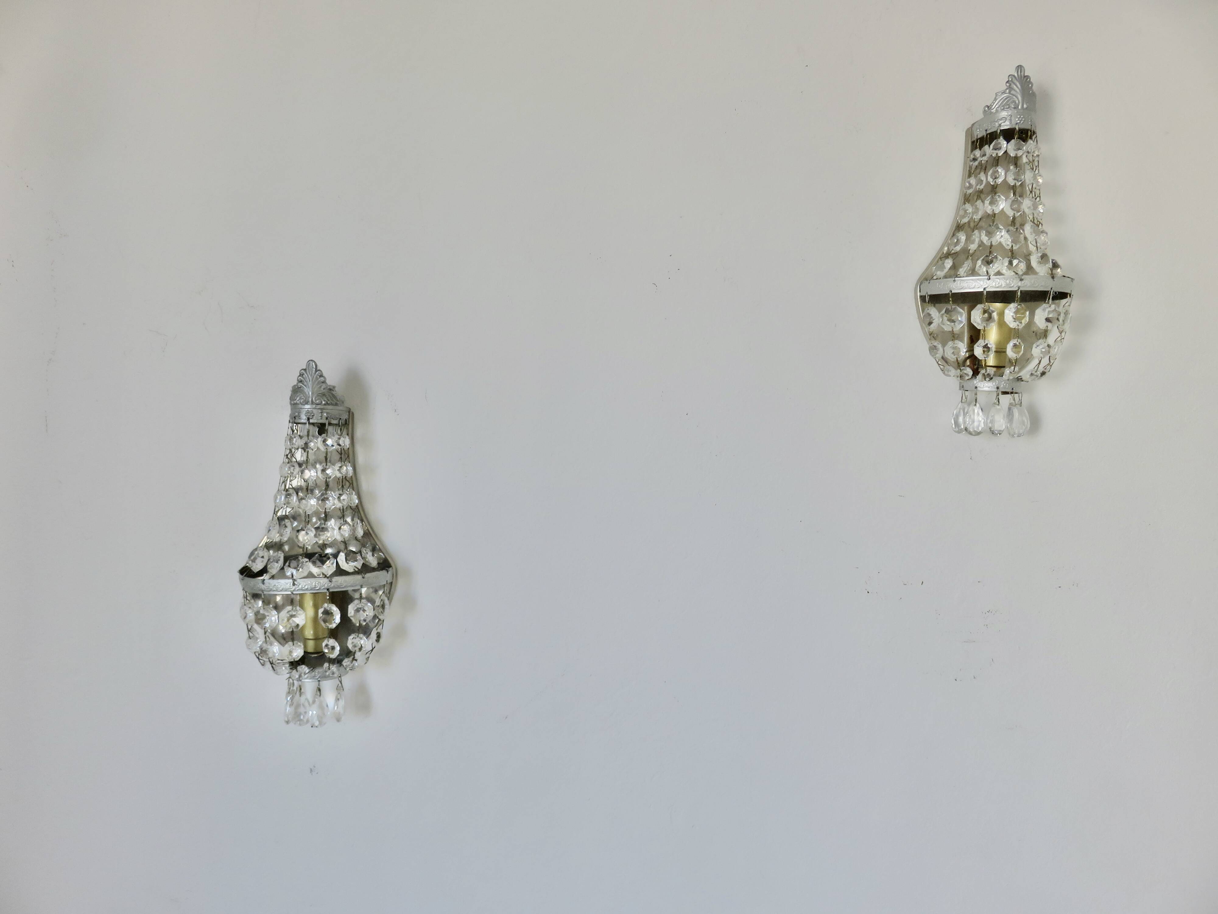 Pair of silver-plated balloon wall lights with pendants, circa 1970.