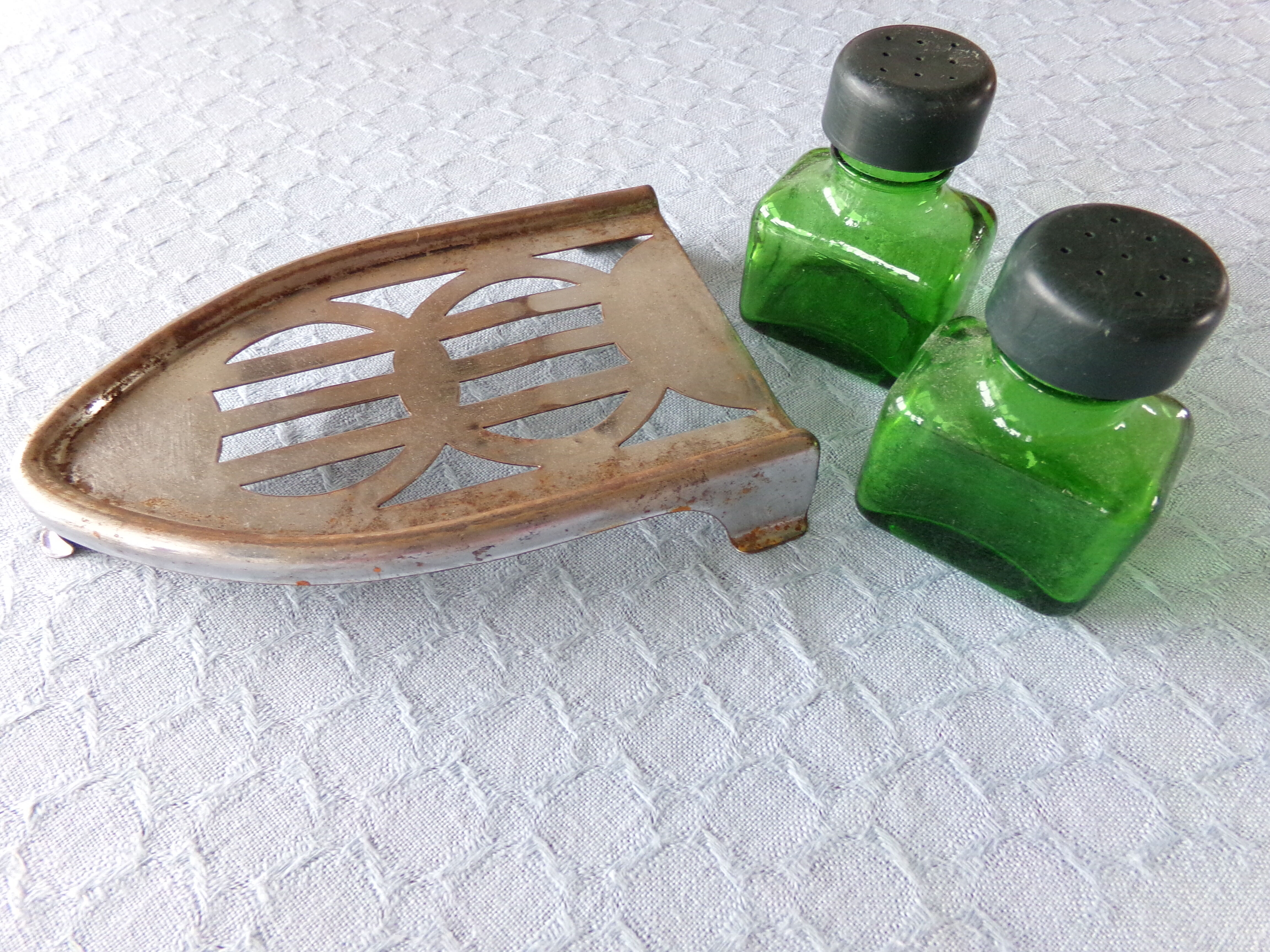 Salt/pepper green glass jars on metal base