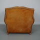 Vintage french moustache back cognac-colored leather club chair
