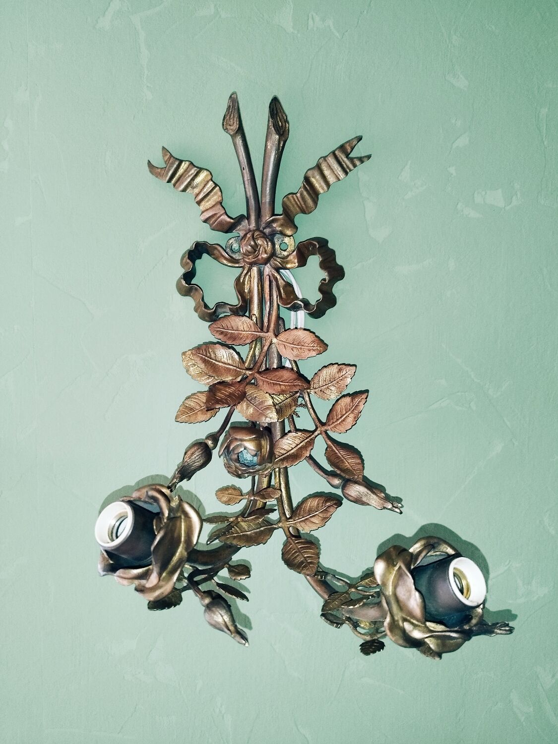 Pair of bronze and gilded metal wall sconces in the Louis XVI style.