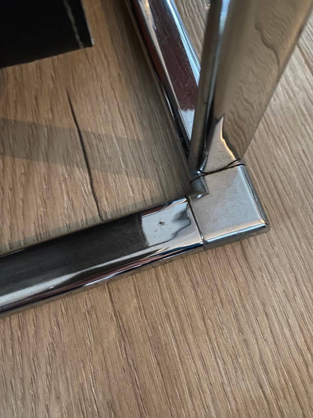 Chrome metal and leather magazine rack