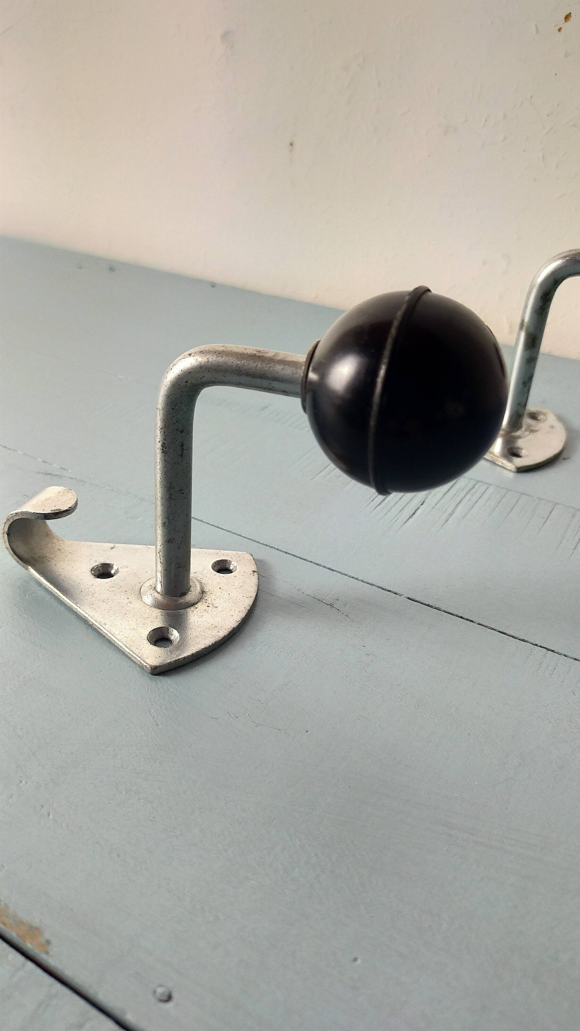 2 Bakelite ball coat hooks
