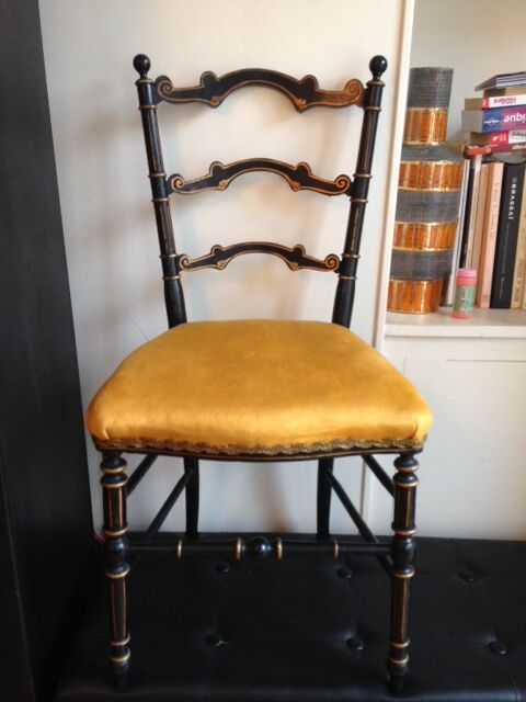 Pair of black and gold chairs