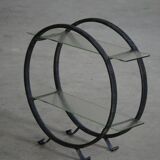 Decorative shelf unit, round metal frames with curved legs and glass shelves, 1960.