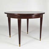 Art Deco mahogany round table by Jacques Adnet, circa 1940